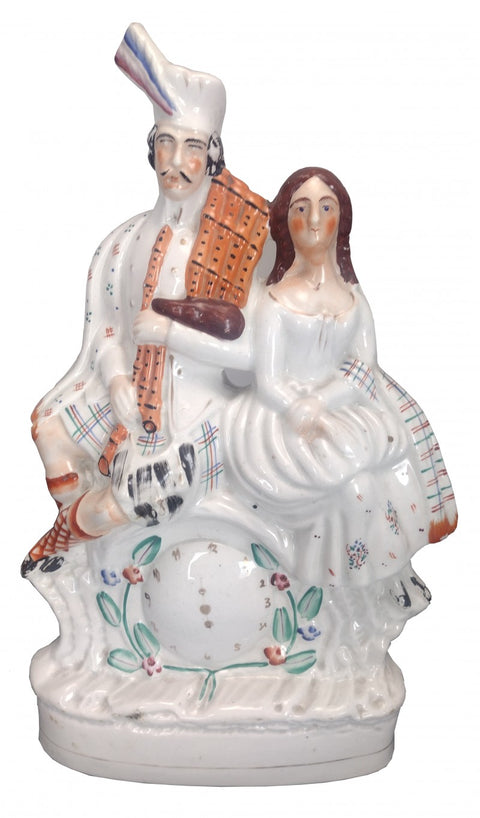 Seated Scotsman and Wife Antique Staffordshire Figure